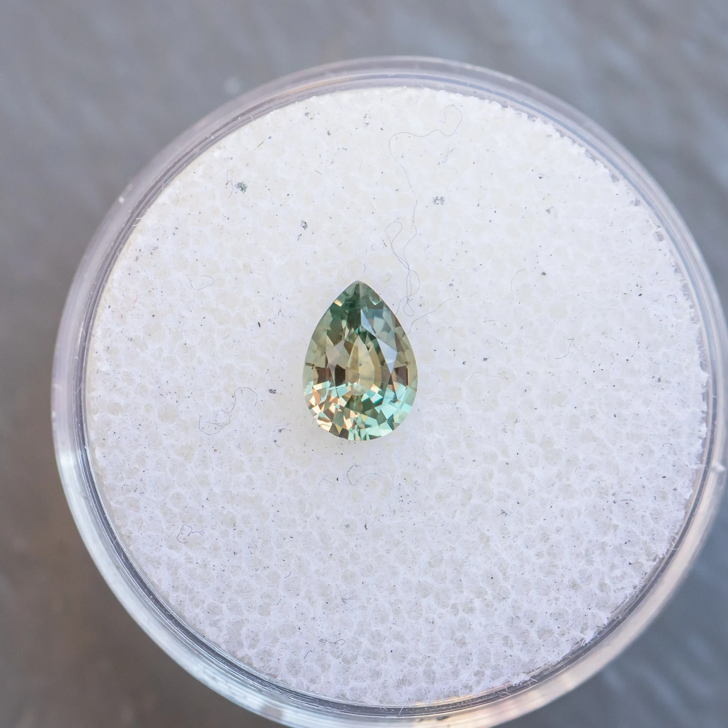 0.83CT PEAR MONTANA SAPPHIRE, COLOR SHIFTING GREEN TO PURPLE GREY, 6.99X5X3.20MM, UNTREATED